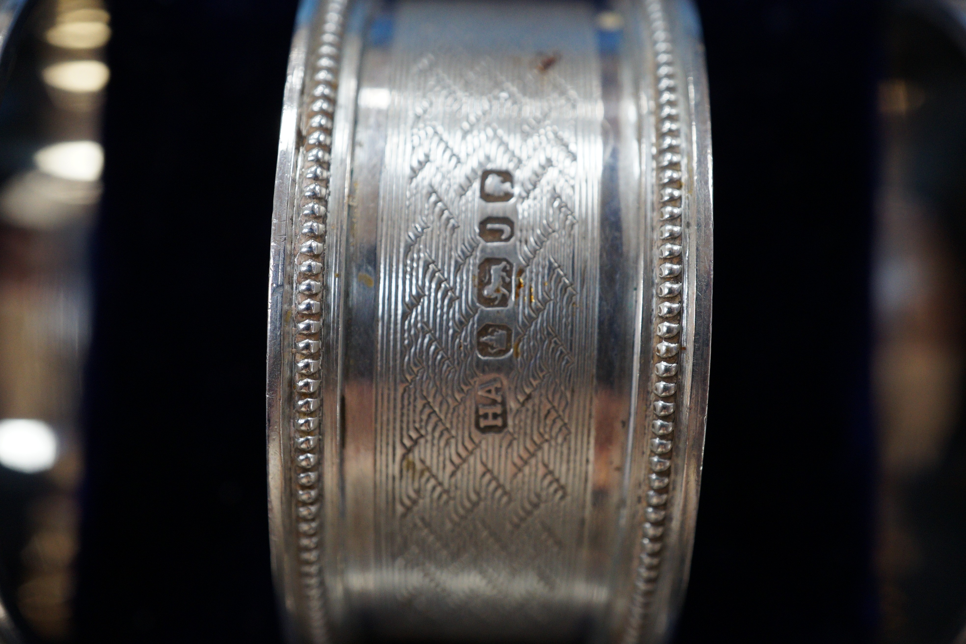 A cased set of six Victorian engraved silver napkin rings, Atkin Brothers, Sheffield, 1876.